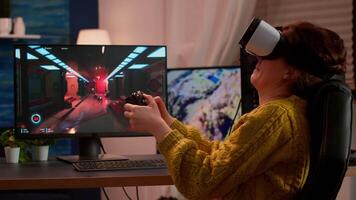 Professional player wearing virtual reality headset holding wireless controller performing shooter game. Virtual shooter game championship in cyberspace, esport player playing during gaming tournament video
