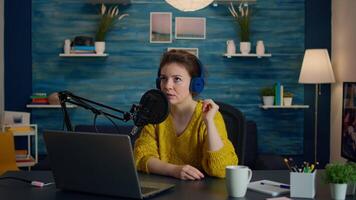 Influencer discussing with fan during live on social media recording new vlog in living room. On-air online production internet broadcast show host streaming live content, blogger during livestreaming video