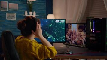 Professional esports gamer playing shooter mock-up game with new graphics and lots of actions. Pro esport team player streamer playing gaming tournament on powerful RGB computer, using modern streaming technology video