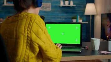 blogger reading emails on laptop with green screen display during broadcast. Creative online show On-air production internet broadcast host streaming live content using chroma key laptop video