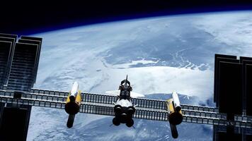 International Space Station , ISS floating in orbit above planet earth in outer space. Floating spaceship in the univers, shuttle into atmosphere, images from NASA. 3D render animation video