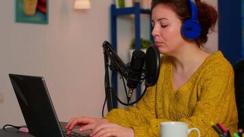 Vlogger recording podcast using mic at home studio using technologies for creating content for bloggers and influencers. On-air online production internet broadcast show host streaming live content video