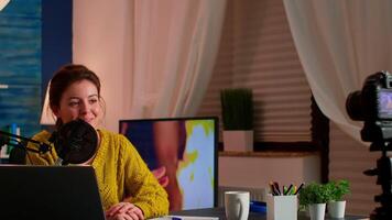 Influence vlogger talking and smiling during live streaming, broadcast with internet subscribers. Social media people , content maker, e-commerce concept. working from home podcast studio. video
