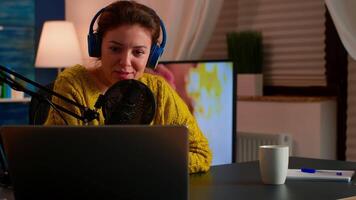 Vlogger speaking with follower on live using professional microphone wearing headphones. Creative online show On-air production internet broadcast host streaming live content, recording digital social video