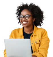 A smiling woman with curly hair works on a laptop while wearing a yellow jacket in a bright setting, cut out - stock . png