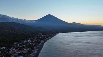 Hyper lapse with coastline and volcano mountain on sunset. Drone view hyperlapse in Bali video