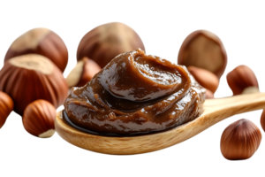 Hazelnut Spread in a Wooden Spoon with Hazelnuts on a Transparent Background png