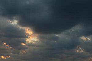 Cloudscape, Colored Clouds at Sunset near the Ocean in a Cloudy Day photo
