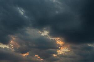 Cloudscape, Colored Clouds at Sunset near the Ocean in a Cloudy Day photo