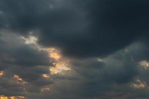 Cloudscape, Colored Clouds at Sunset near the Ocean in a Cloudy Day photo