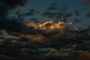 Cloudscape, Colored Clouds at Sunset near the Ocean in a Cloudy Day photo