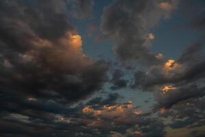 Cloudscape, Colored Clouds at Sunset near the Ocean in a Cloudy Day photo