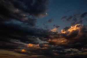Cloudscape, Colored Clouds at Sunset near the Ocean in a Cloudy Day photo