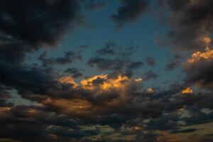 Cloudscape, Colored Clouds at Sunset near the Ocean in a Cloudy Day photo