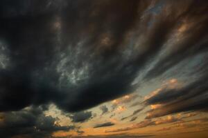 Cloudscape, Colored Clouds at Sunset near the Ocean in a Cloudy Day photo