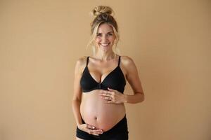 photo of pregnant woman standing pose with beige background,