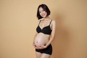 photo of pregnant woman standing pose with beige background,