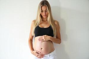 photo of pregnant woman standing pose on white background,