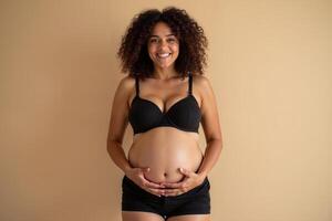 photo of pregnant woman standing pose with beige background,