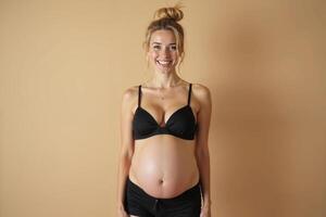 photo of pregnant woman standing pose with beige background,