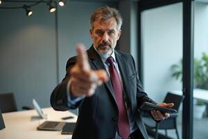 photo of man in suit outfit pointing index finger in the office,