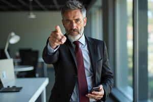 photo of man in suit outfit pointing index finger in the office,