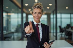 photo of woman in suit outfit pointing index finger in the office,