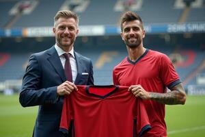 photo of coach and player holding shirt in the stadium field at signing contract event,