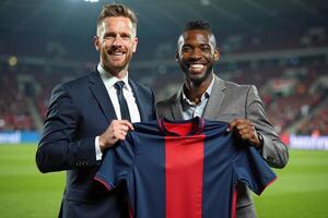 photo of coach and player holding shirt in the stadium field at signing contract event,