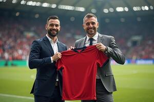 photo of coach and player holding shirt in the stadium field at signing contract event,