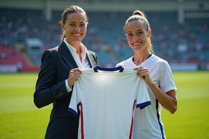 photo of coach and player holding shirt in the stadium field at signing contract event,