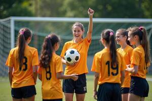 photo of coach instructor trainer teaching teenage player at soccer field,