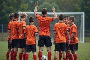 photo of coach instructor trainer teaching teenage player at soccer field,