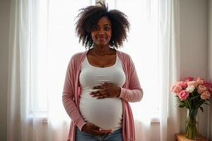 photo of pregnant woman relaxing standing both hands touching her belly at her house,