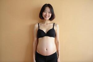 photo of pregnant woman standing pose with beige background,
