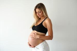 photo of pregnant woman standing pose on white background,
