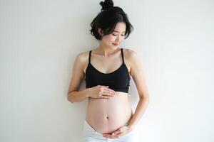 photo of pregnant woman standing pose on white background,