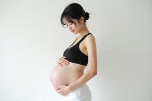 photo of pregnant woman standing pose on white background,