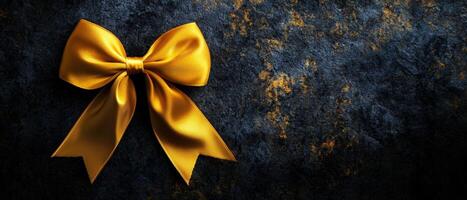 Yellow Satin Bow on Grunge Background photo
