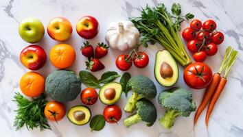 Assorted Fresh Fruits and Vegetables on Marble Background photo