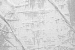 Gray color on white crumpled and creased paper poster texture background photo