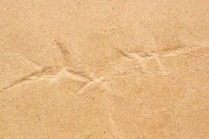 Abstract crumpled and creased recycle brown paper texture background photo