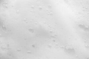 Abstract white soap foam bubbles texture background photo