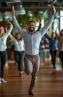 Office workers from different backgrounds engaged in group stretching exercises during a break photo