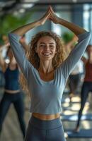 Office workers from different backgrounds engaged in group stretching exercises during a break photo