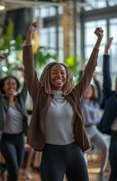 Office workers from different backgrounds engaged in group stretching exercises during a break photo