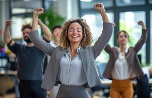 Office workers from different backgrounds engaged in group stretching exercises during a break photo