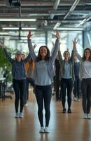 Office workers from different backgrounds engaged in group stretching exercises during a break photo