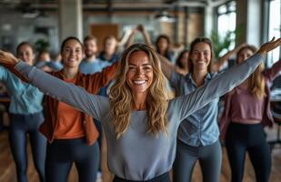 Office workers from different backgrounds engaged in group stretching exercises during a break photo