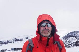portrait of climber on the snowy slope of Mount Elbrus on the way to the top. Elbrus is the highest peak in Europe photo